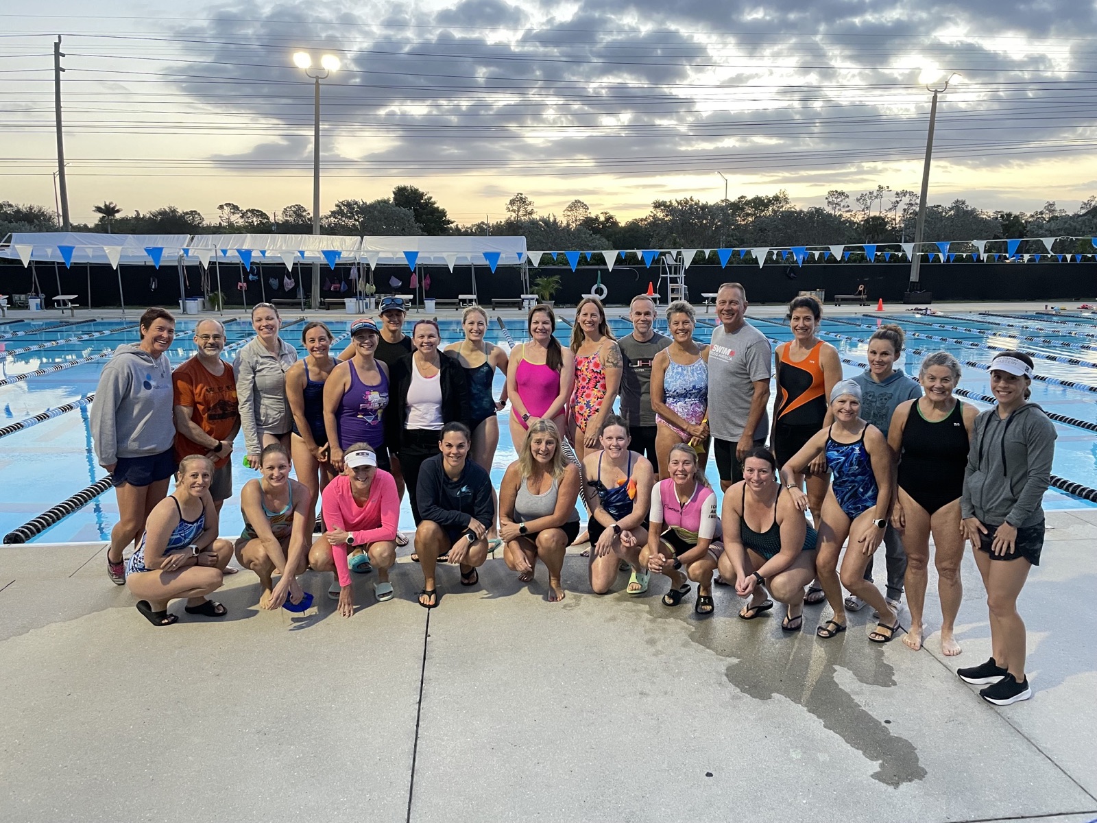 The MSM + JHC Swimcation group poolside at sunset